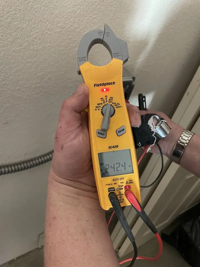 Voltage testing with clamp meter during Electrical Installation Services in Hastings